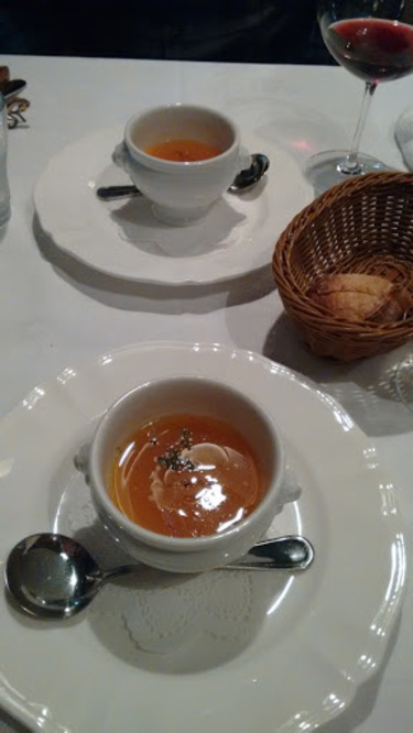table setting of soup and wine